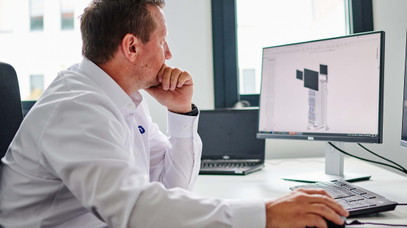 Employee sitting infront of a computer