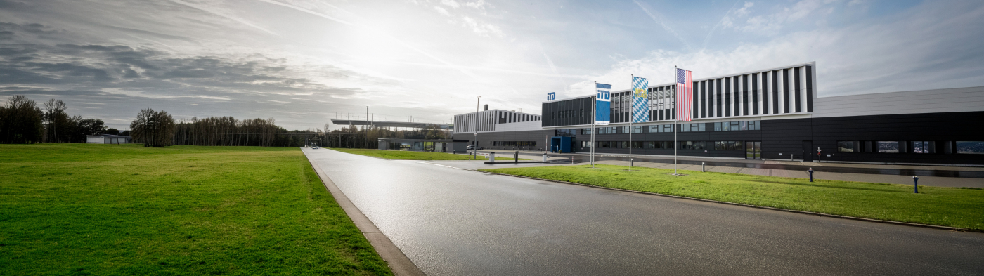 iTD headquarters building facade with logo