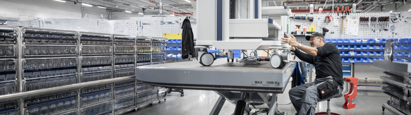 Worker assembling a medical cart