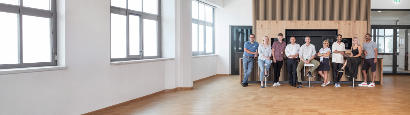 Multi-cultural team meeting and working together at table